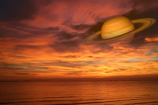 Saturn back night cloud sunset sky on sea. concept Saturn near Earth, Elements of this image furnished by NASA