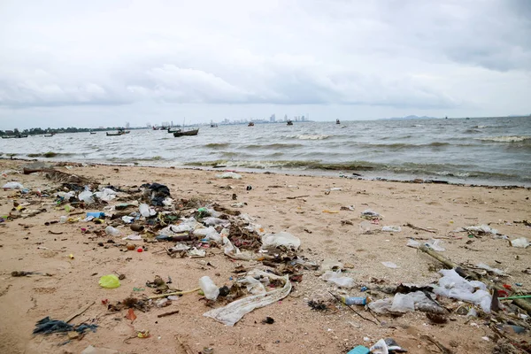 foam plastic bamboo bottle glass garbage and waste pollution on beach