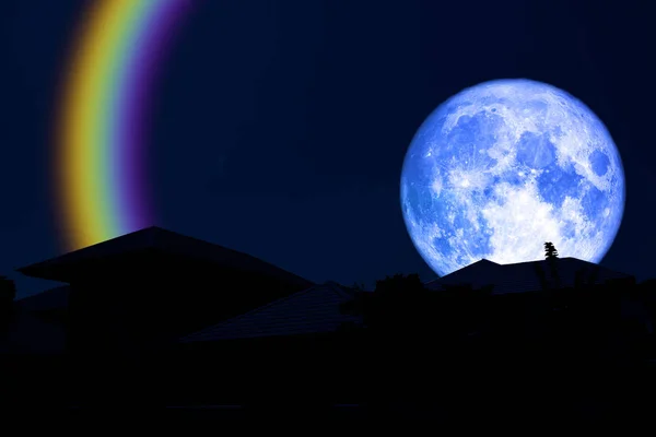 full blue moon halo back over silhouette roof, Elements of this image furnished by NASA