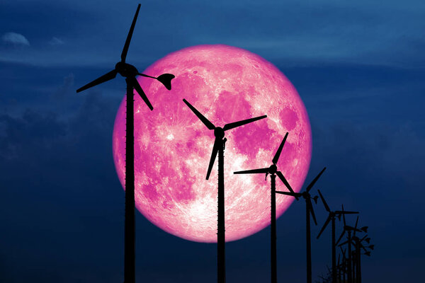 snow moon back Wind turbines produce wind energy which is a clean energy to replace coal and oil energy, Elements of this image furnished by NASA