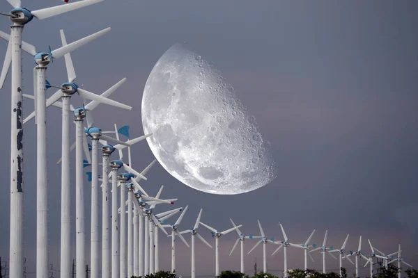 half old moon back Wind turbines produce wind energy which is a clean energy, Elements of this image furnished by NASA