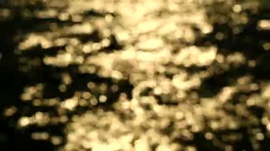 deniz yüzeyinde gün batımı bulanıklık ve bokeh yansıma ışık