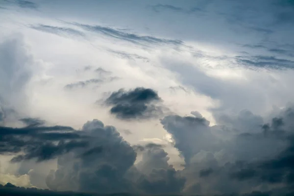 storm silhouette heap cloud sun ray in gray skycape black cloud