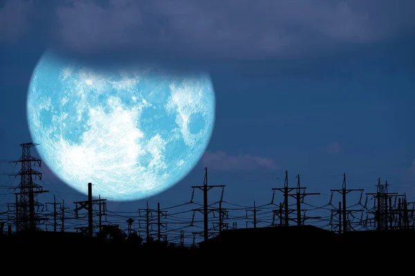 blue milk moon back on silhouette electric pole on night sky