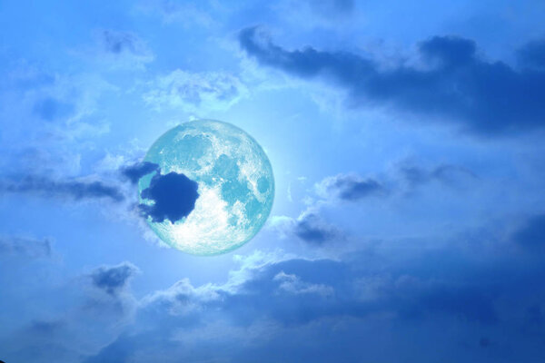 Full strawberry moon back on silhouette heap cloud on night sky, Elements of this image furnished by NASA