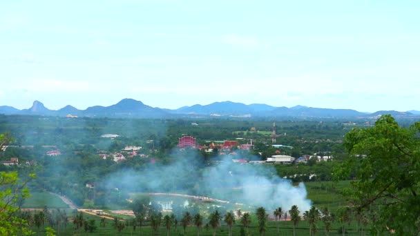 Temple and smoke back the hill and mountain clear sky background — Stock Video