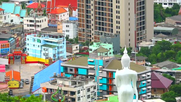 A high angle view showing a Buddhist temple In the city and the old style house, a modern building in the city — Stock Video