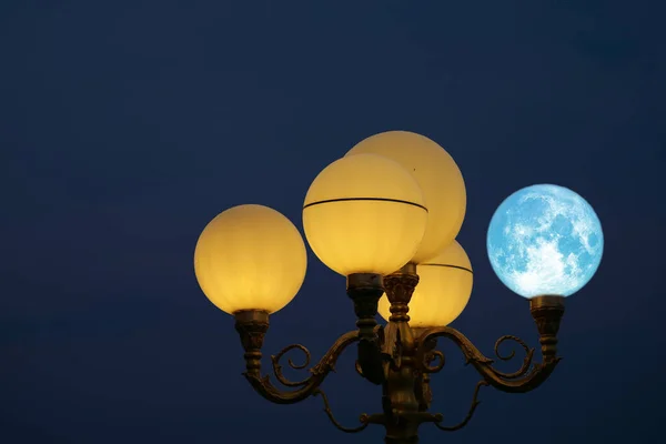 Super blue moon back on light pole in night sky, Elements of this image furnished by NASA