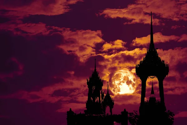 Full Crow blood Moon and silhouette top pagoda and night red sky, Elements of this image furnished by NASA