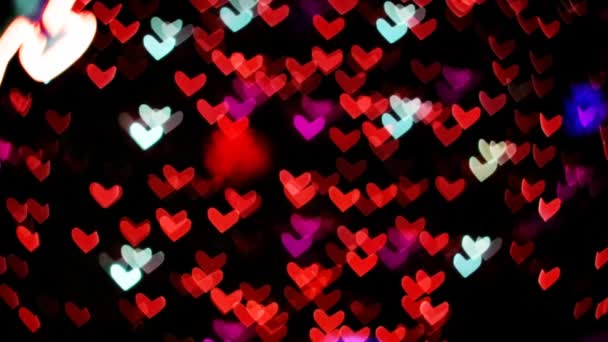 Oskärpa och bokeh hjärta form röd färg på natten ljus av promenadgatan — Stockvideo