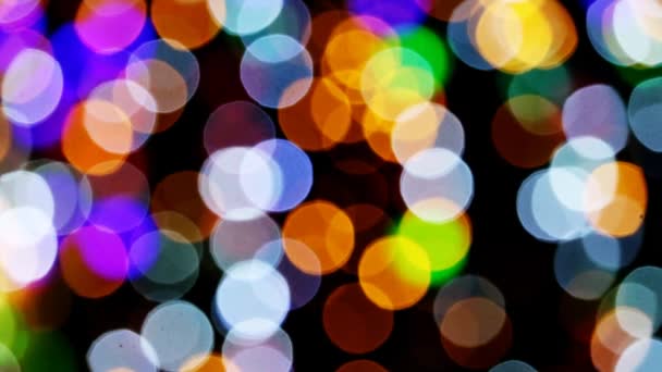 Large blur and bokeh colorful rainbow decorate light on the night wall — Stock Video