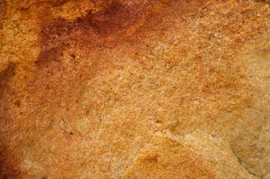 İç duvar kağıdı ve arka plan için mağaranın antik turuncu granit yüzeyi