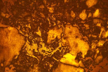 İç ve duvar kağıdı arka planında mağaranın mineral altın lav mermer granit yüzeyi