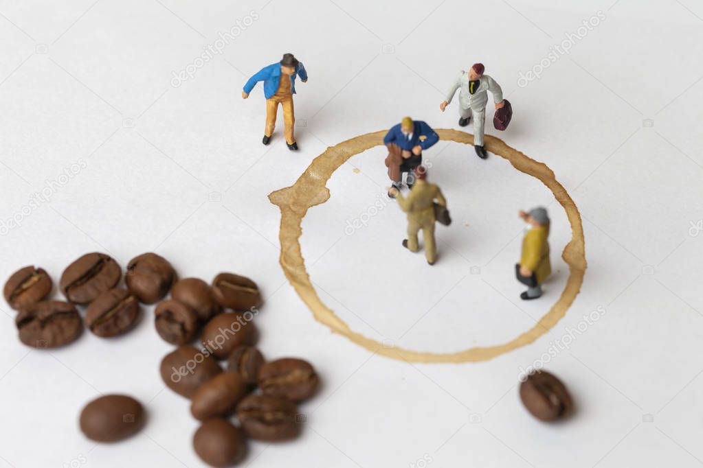 Coffee break concept with lose up miniature people and coffee. 