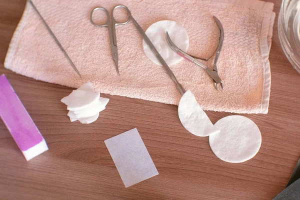 Manicure tools on the towel on table. — Stock Photo, Image