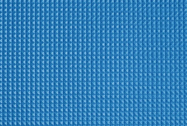 Vierkante patroon van zachte kunststof mat. Closeup. — Stockfoto