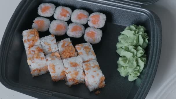 Set of rolls in plastic packaging on the kitchen table. — Stock Video