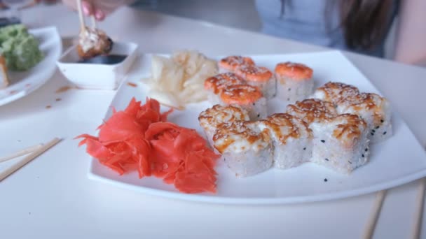 Woman Eating Sushi Rolls Wooden Chopsticks Hands Close — Stock Video