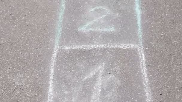 Hopscotch game on asphalt in Park. Painted with colorful chalks. — Stock Video