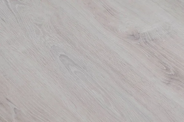 Textura laminada ligera de madera en el suelo . —  Fotos de Stock