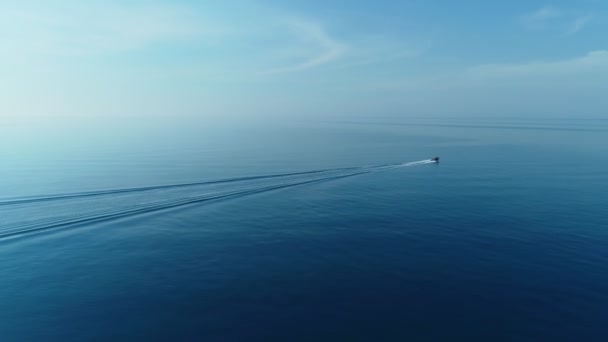 Sea background with sailboat in open sea, flying over the turquoise calm water. — Stock Video