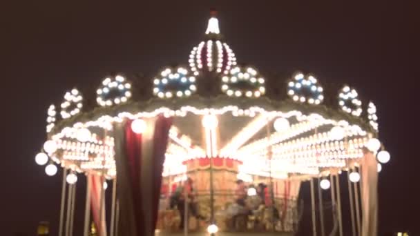 Merry-Go-Round at the Christmas fair. Close-up view, blur. — Stock Video