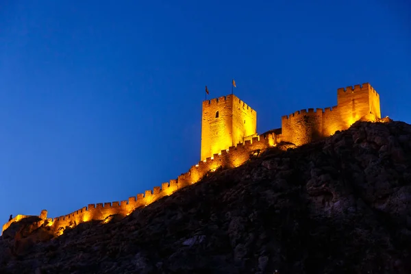Spain, the old castle of SAX in the night on the mountain.