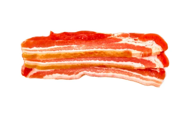 Panceta fatias finas de carne de porco crua no fundo branco . — Fotografia de Stock