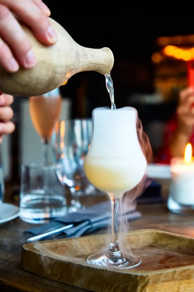 The cocktail is prepared in a clay pitcher