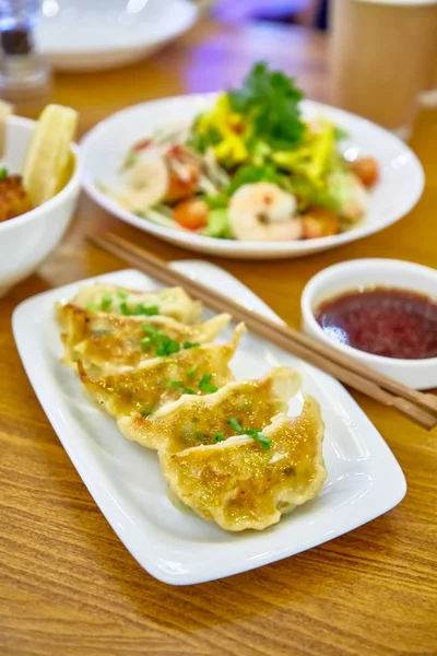 Have gyoza or fried dim sums are on a plate in the restaurant — Stock Photo, Image
