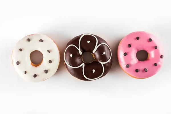 Bunt Glasierte Donuts Draufsicht Über Weißen Hintergrund Isoliert — Stockfoto
