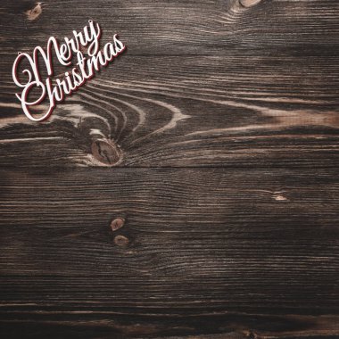 Yukarıdan görüntülemek bir Merry Christmas kitabe kare, ahşap arka plan, metin yazma yeri olan tebrik kartı
