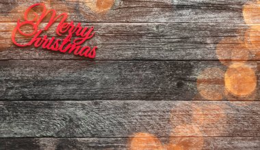 Eski ahşap arka plan. Kırmızı Christmas Merry yazıt, metin için yer. Üstten görünüm. Efekt ışıkları