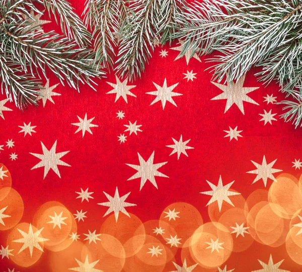 Red Xmas Background Stars Fir Branches Light Blips Top View — Stock Photo, Image
