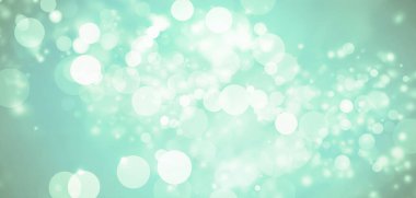 Bulanık parlak daireler gök mavisi renginde. Rüya gibi soyut bokeh arkaplanı oluşturuyor.