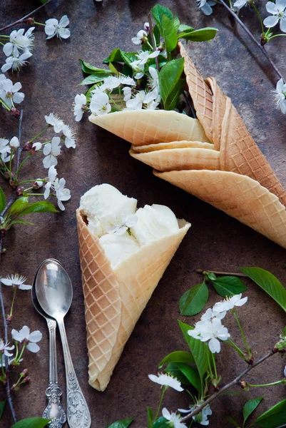 Fresh flowers and ice cream in Waffle cone still life