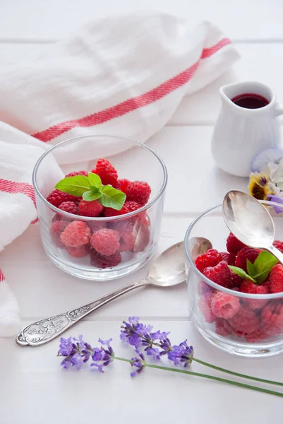 Fresh Organic Raspberries in glasses for Breakfast Royalty Free Stock Photos