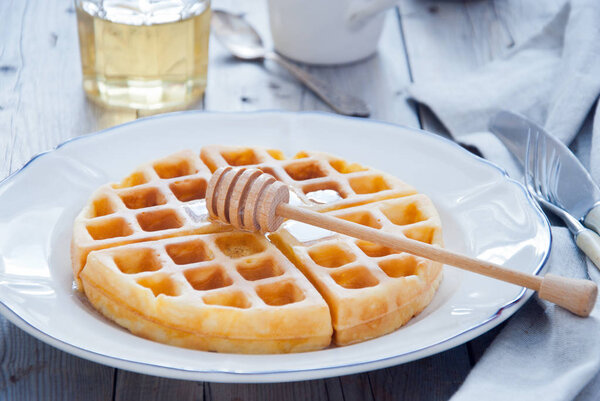 Homemade Waffles with organic honey for breakfast