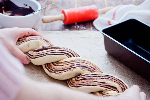 Making Swirl Brioche with chocolate, traditional Polish sweet Christmas bread Stock Photo