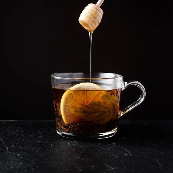 Black tea with honey and lemon