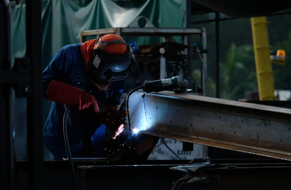 Wekder worker in construction factory.