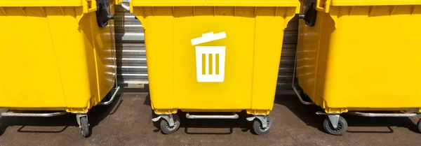yellow and green street garbage containers