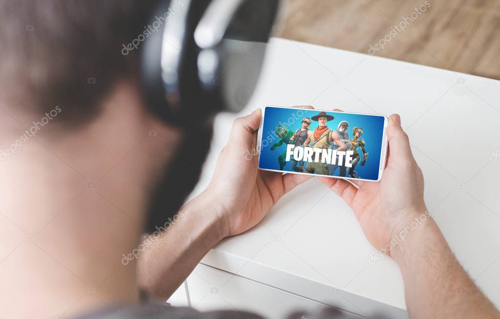 Ufa, Russia - February 7, 2019: Lenovo phone Android smartphone playing Fortnite battle royale mobile games.