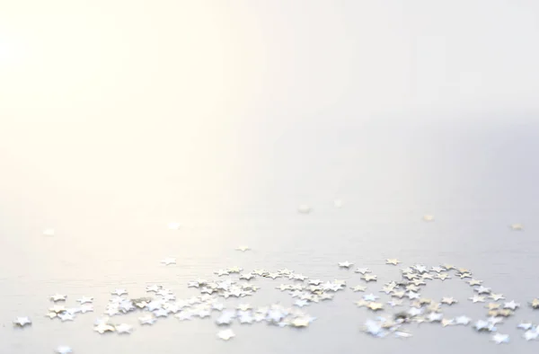 White minimal background. Silver stars top view, flatlay Stock Image