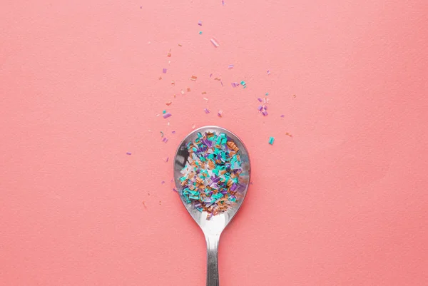 Environmental pollution and water microplastic. Micro plastic with spoon — Stock Photo, Image