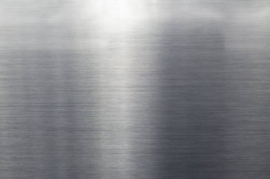 Metalin doku yüzeyi gri renktedir. Parlak, paslanmaz çelik veya gümüş arkaplan.