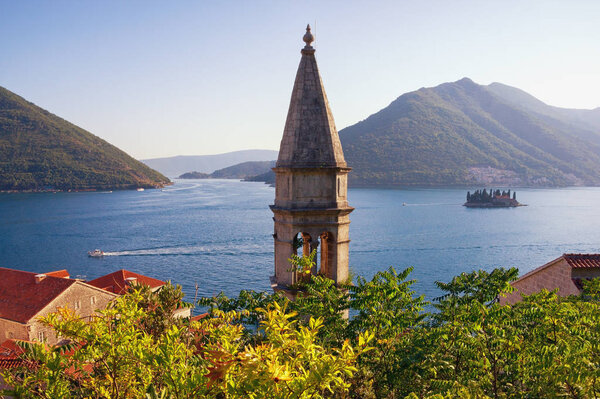Beautiful Mediterranean landscape. Montenegro, Perast town. View of  Bay of Kotor with Island of Saint George and bell tower of the Church of Our Lady of Rosary. Travel and tourism concept