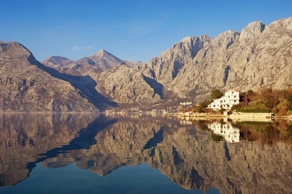 Mountains reflected in the water, winter Mediterranean landscape. Montenegro, Adriatic Sea, Bay of Kotor