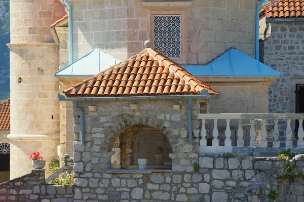 Religious architecture, details. Walls of ancient Church of Our Lady of the Rocks ( Gospa od Skrpjela ) on sunny summer day. Montenegro