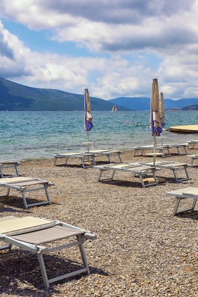 Summer beach vacation,  problems of  tourist season 2020. Beautiful Mediterranean landscape.  Montenegro,  Adriatic Sea, Bay of Kotor, Tivat city